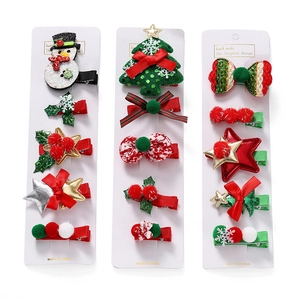 Christmas hair clips set with snowman, tree and bow designs on white card