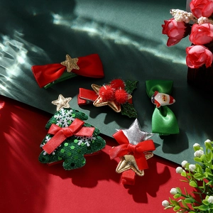 Detailed set of 5 Christmas hair clips with Santa Claus, trees, and ribbon bows