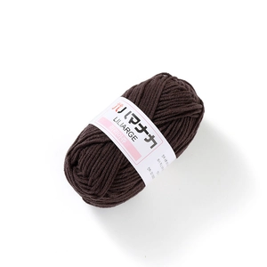 Macro detail of dark coffee brown 4-ply milk cotton yarn roll with LILIARGE brand label