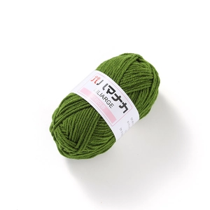 Close-up of grass green milk cotton yarn roll showing soft texture for DIY crochet knitting