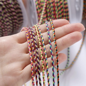 Close-up of multicolor braided cotton cords for DIY handmade bracelets and jewelry crafts