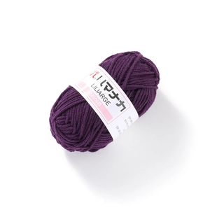 Detailed macro view of dark purple 4-ply milk cotton yarn with LILIARGE label