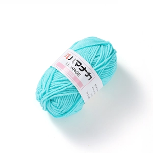 Detailed view of light blue 4-ply cotton yarn ball with soft fiber texture for DIY crochet