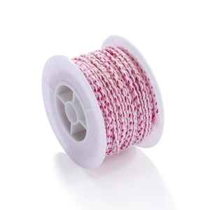 Detail of two-tone braided cotton cord in pink and white on a plastic spool