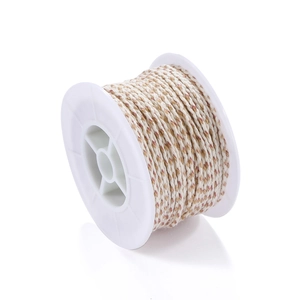 Detailed view of beige and brown braided cotton cord on white spool for DIY jewelry