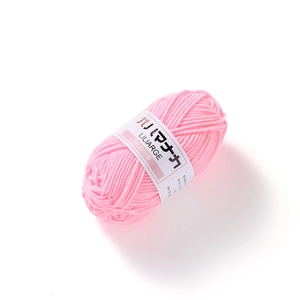 Close-up of pink 4-ply milk cotton yarn roll with white Liliarge label for DIY knitting