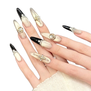 Luxurious black and gold gradient long almond press-on nails with champagne cat-eye gems