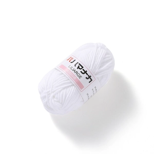 Detailed texture of white 4-ply cotton milk yarn with Hamanaka brand label