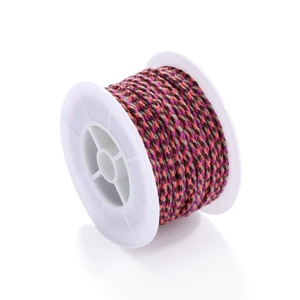Detail of four-color woven cotton cord on white spool for DIY bracelet making