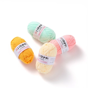 Detailed view of colorful 4-ply milk cotton yarn rolls for DIY crochet and knitting crafts