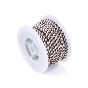 Macro detail of brown and white braided cotton cord wound on a plastic spool for DIY jewelry