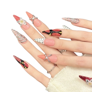 Pink and red stiletto press-on nails with 3D flowers and metallic spiral accents