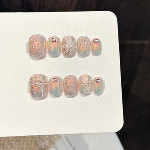 Iridescent snow star press-on nails with blue gradient aurora finish and crystals