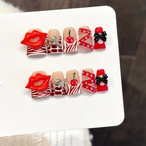 Handmade press-on nails with Y2K cherry, 3D red lips and gothic skull design elements