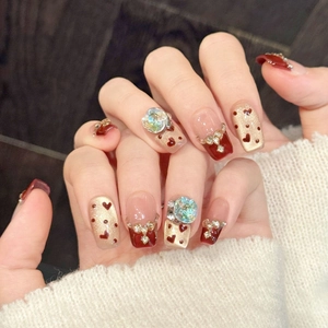 Handmade burgundy heart press-on nails with champagne glitter and rhinestones