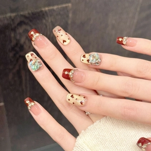 Burgundy and gold press-on nails with heart patterns and rhinestones on square shape