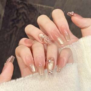 Pink and brown gradient coffin press-on nails with spider charms and bow rhinestones