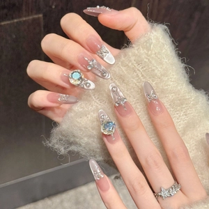 Luxurious long almond press-on nails with blue butterfly charms and silver cat eye gradient