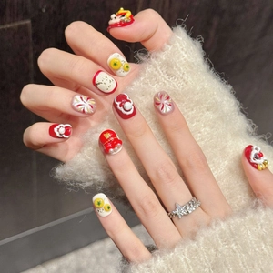 3D embossed red and gold Lion Dance press-on nails with traditional Chinese New Year symbols