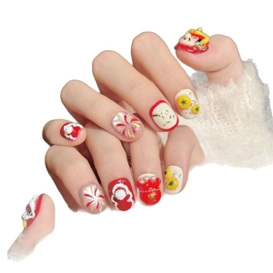 Chinese New Year press-on nails featuring red lion dance designs and golden fortune bags