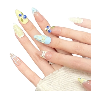 Pink and yellow almond press-on nails with 3D lemon and blueberry fruit charms