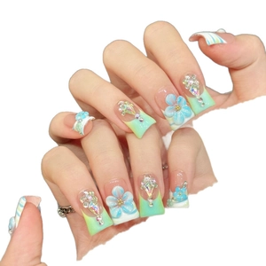 Pink and blue gradient handmade press-on nails with 3D floral accents and rhinestones