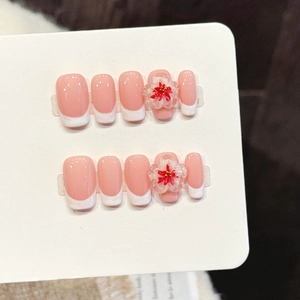 Pink and white French press-on nails with 3D floral accents and glossy finish set