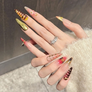 Handmade amber tortoiseshell press-on nails with golden accents and butterfly details