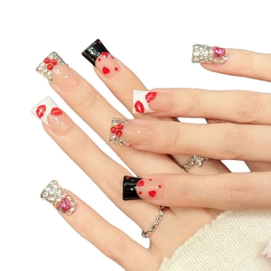 Handmade press-on nails with red lip prints, heart patterns and luxury rhinestone accents