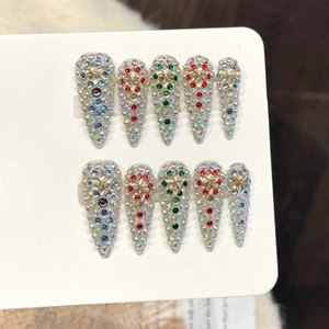 Sparkling long almond handmade press-on nails with multi-color rhinestones and star accents
