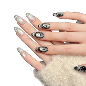 Silver and black gradient press-on nails with cat-eye effect and gothic cross designs