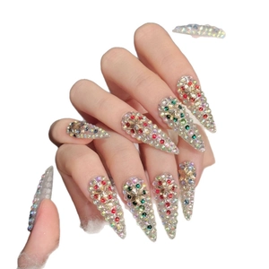 Luxurious stiletto press-on nails with colorful rhinestones and mixed gemstones design