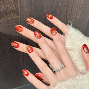 Chinese New Year red and gold press-on nails with lucky cat and fortune patterns