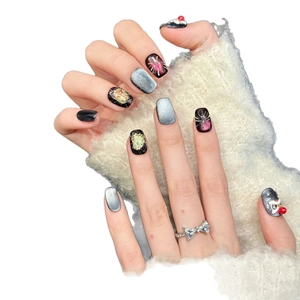 Blue cat-eye press-on nails with fireworks design and glittering sequin accents