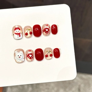 Handmade Christmas snowman press-on nails with 3D embossed red and gold festive designs