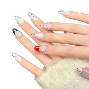Sparkling silver handmade press-on nails with red and black polka dots and 3D bow decor