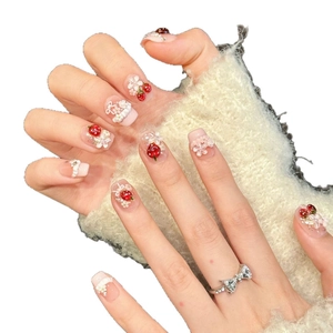 Pink strawberry press-on nails with 3D fruit designs, pearls and floral embossed details