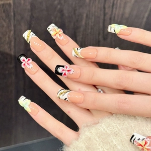 Handmade press-on nails with floral 3D relief, tiger patterns, and gold chain details