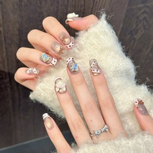 Handmade brown cat-eye press-on nails with 3D bunny, bows, and heart-shaped ring