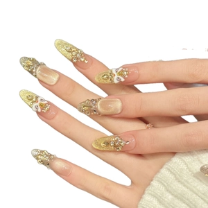 Luxury handmade press-on nails with gold glitter, 3D bows and rhinestone charms