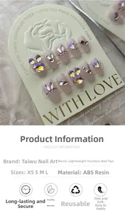 Detailed view of ABS resin press-on nails with sparkling rhinestones and cute bunny decor