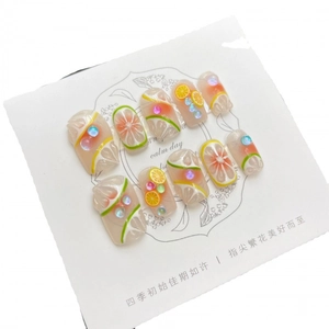 Handmade summer lemon press-on nails with 3D citrus slices and crystal rhinestones