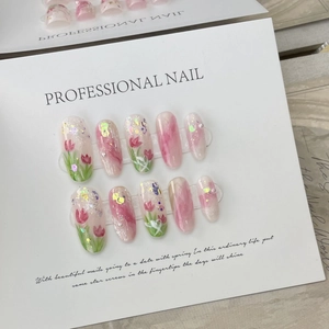 Handmade pink tulip press-on nail set with marble finish, glitter and pearl accents