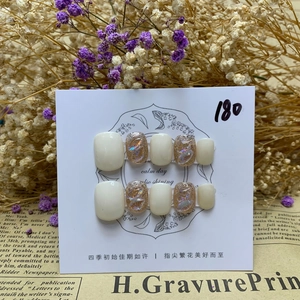 Macro detail of white aurora gemstones and 3D wave patterns on handmade press-on nails