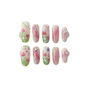 Handmade cinnamon nude press-on nails with tulip art and sparkling diamond accents