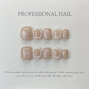 Handmade press-on nails with delicate lily of the valley, pearls, and gold chain details