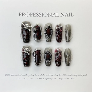Gothic press-on nails set with silver skull, cross accents and marble texture