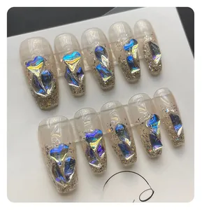 Detail of aurora crystal heart glitter press-on nails on white display card