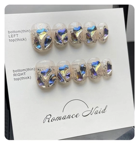 Detailed set of 10 handmade press-on nails featuring aurora rhinestones and laser hearts