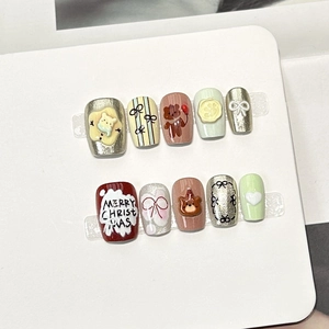 Handmade Christmas press-on nails set with red 3D bears, bows, and heart designs